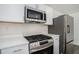 Stainless steel appliances and white shaker cabinets in kitchen at 1685 Harbin Sw Rd, Atlanta, GA 30311