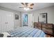 Spacious bedroom with a dresser, double bed, and ensuite bathroom at 2129 Lakeland Ct, Dacula, GA 30019