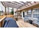 Wooden deck with pergola, chairs, and grill at 2129 Lakeland Ct, Dacula, GA 30019