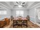 Bright dining room features a wood table, chairs, and hardwood floors at 2129 Lakeland Ct, Dacula, GA 30019