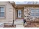 Inviting front entrance with stone accents and landscaping at 2129 Lakeland Ct, Dacula, GA 30019