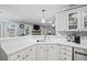 Spacious kitchen with white cabinets and corner sink at 2129 Lakeland Ct, Dacula, GA 30019