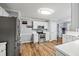 Well-equipped kitchen with white cabinets and stainless steel appliances at 2129 Lakeland Ct, Dacula, GA 30019