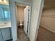 Small half bathroom with toilet and grey tile floor at 4005 Riverchess Lot 127 Sw Dr, Atlanta, GA 30331