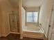 Bathroom with shower and bathtub at 4005 Riverchess Lot 127 Sw Dr, Atlanta, GA 30331