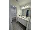 Bathroom with double vanity and grey floor tile at 4005 Riverchess Lot 127 Sw Dr, Atlanta, GA 30331