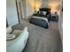 Bedroom with grey carpet and sitting chair at 4005 Riverchess Lot 127 Sw Dr, Atlanta, GA 30331