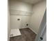 Laundry room with floor drain and overhead shelving at 4005 Riverchess Lot 127 Sw Dr, Atlanta, GA 30331