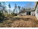 Large backyard with tree coverage and patio at 113 Hillmont Dr, Woodstock, GA 30188