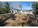 Ranch home on a sloping lot with mature trees at 113 Hillmont Dr, Woodstock, GA 30188