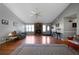 Living room with hardwood floors, fireplace, and large windows at 113 Hillmont Dr, Woodstock, GA 30188