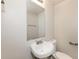 Small bathroom with toilet, sink, and a mirror at 1203 Sandune Dr, Norcross, GA 30093