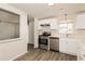 Modern kitchen with stainless steel appliances and white cabinets at 1203 Sandune Dr, Norcross, GA 30093