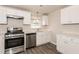 Modern kitchen with stainless steel appliances and white cabinets at 1203 Sandune Dr, Norcross, GA 30093