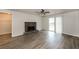 Living room with stone fireplace and sliding glass doors to deck at 1203 Sandune Dr, Norcross, GA 30093