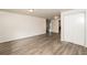 Living room with gray vinyl flooring and neutral walls at 1203 Sandune Dr, Norcross, GA 30093