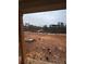 View of undeveloped backyard from covered porch at 1330 Temple Draketown Rd, Temple, GA 30179