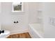 Small bathroom with shower/tub combo and hardwood floors at 1330 Temple Draketown Rd, Temple, GA 30179