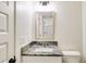 Bathroom boasts granite countertop, single sink, and white vanity at 1330 Temple Draketown Rd, Temple, GA 30179