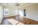 Spacious bedroom with a tray ceiling, fan, and abundant natural light from large windows at 1330 Temple Draketown Rd, Temple, GA 30179