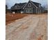 Gray farmhouse with attached garage, gravel driveway at 1330 Temple Draketown Rd, Temple, GA 30179