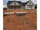 Newly constructed farmhouse with gray siding and black roof at 1330 Temple Draketown Rd, Temple, GA 30179