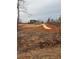 House from a distance, long driveway, unfinished land at 1330 Temple Draketown Rd, Temple, GA 30179