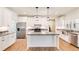 White kitchen features granite countertops and stainless steel appliances at 1330 Temple Draketown Rd, Temple, GA 30179