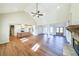 Open-concept living space with wood floors, a vaulted ceiling, and a fireplace at 1330 Temple Draketown Rd, Temple, GA 30179