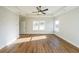 Spacious main bedroom featuring tray ceiling, wood floors, and large windows at 1330 Temple Draketown Rd, Temple, GA 30179