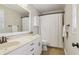 Well-lit bathroom with a modern vanity and shower-tub combination at 201 Nouveau Sw Ct, Lilburn, GA 30047