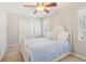 Cozy bedroom featuring a large closet and bright window at 201 Nouveau Sw Ct, Lilburn, GA 30047