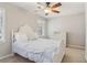 Bedroom featuring a dresser, ceiling fan, and a bed at 201 Nouveau Sw Ct, Lilburn, GA 30047