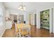 Bright eat-in kitchen with wood floors and views of the kitchen, pantry and backyard at 201 Nouveau Sw Ct, Lilburn, GA 30047