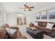 Inviting living room with view to the kitchen and dining area, filled with natural light at 201 Nouveau Sw Ct, Lilburn, GA 30047