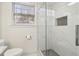 Modern bathroom featuring a walk-in shower with marble tile at 2667 Flair Knoll Ne Dr, Atlanta, GA 30345