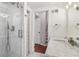 Bright bathroom with marble vanity, shower and access to another room at 2667 Flair Knoll Ne Dr, Atlanta, GA 30345