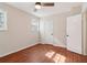 Well-lit bedroom featuring hardwood floors and multiple closets at 2667 Flair Knoll Ne Dr, Atlanta, GA 30345