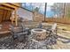 Stone fire pit surrounded by adirondack chairs on a brick patio at 2667 Flair Knoll Ne Dr, Atlanta, GA 30345