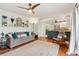 Living room features hardwood floors, gray couch, and view of kitchen at 2667 Flair Knoll Ne Dr, Atlanta, GA 30345