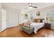 Main bedroom with hardwood floors, a cozy bed, and ample closet space at 2667 Flair Knoll Ne Dr, Atlanta, GA 30345