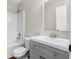 Bathroom with gray vanity, white sink, and shower/tub combo at 11602 Kades Trl, Hampton, GA 30228