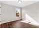 Spacious bedroom featuring wood flooring and a large window at 11602 Kades Trl, Hampton, GA 30228