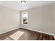 Simple bedroom with hardwood floors and a window at 11602 Kades Trl, Hampton, GA 30228