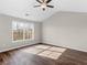 Spacious bedroom with vaulted ceiling, dark floors, and a ceiling fan at 11602 Kades Trl, Hampton, GA 30228