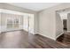 Open dining room with hardwood floors and chandelier at 11602 Kades Trl, Hampton, GA 30228