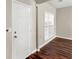 Bright entryway with hardwood floors and white door at 11602 Kades Trl, Hampton, GA 30228