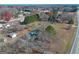 Aerial view of house and property showing large yard, detached buildings and surrounding neighborhood at 1349 Highway 81 E, Mcdonough, GA 30252