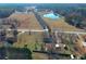 Expansive aerial shot of property, highlighting the pond, trees and open spaces at 1349 Highway 81 E, Mcdonough, GA 30252