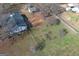 Aerial view of house and backyard showing detached building and a large fenced yard at 1349 Highway 81 E, Mcdonough, GA 30252